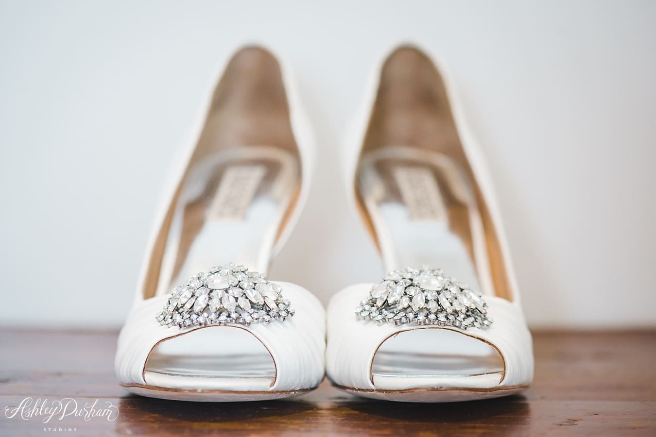 white wedding shoes with broach