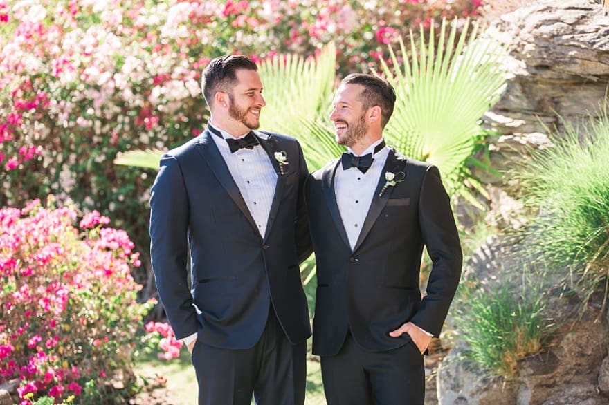 fun groom and groomsmen poses, black tux, navy blue tux, black and blue tux