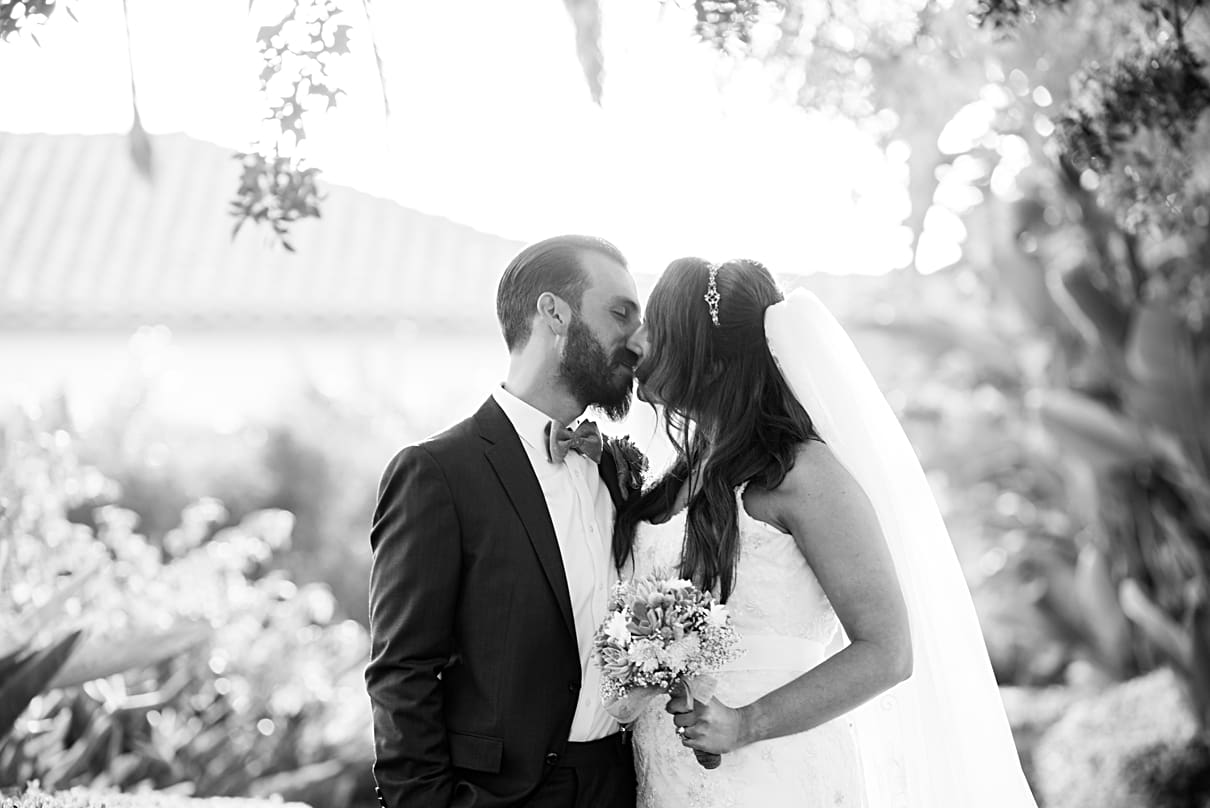 black and white bride and groom kissing 