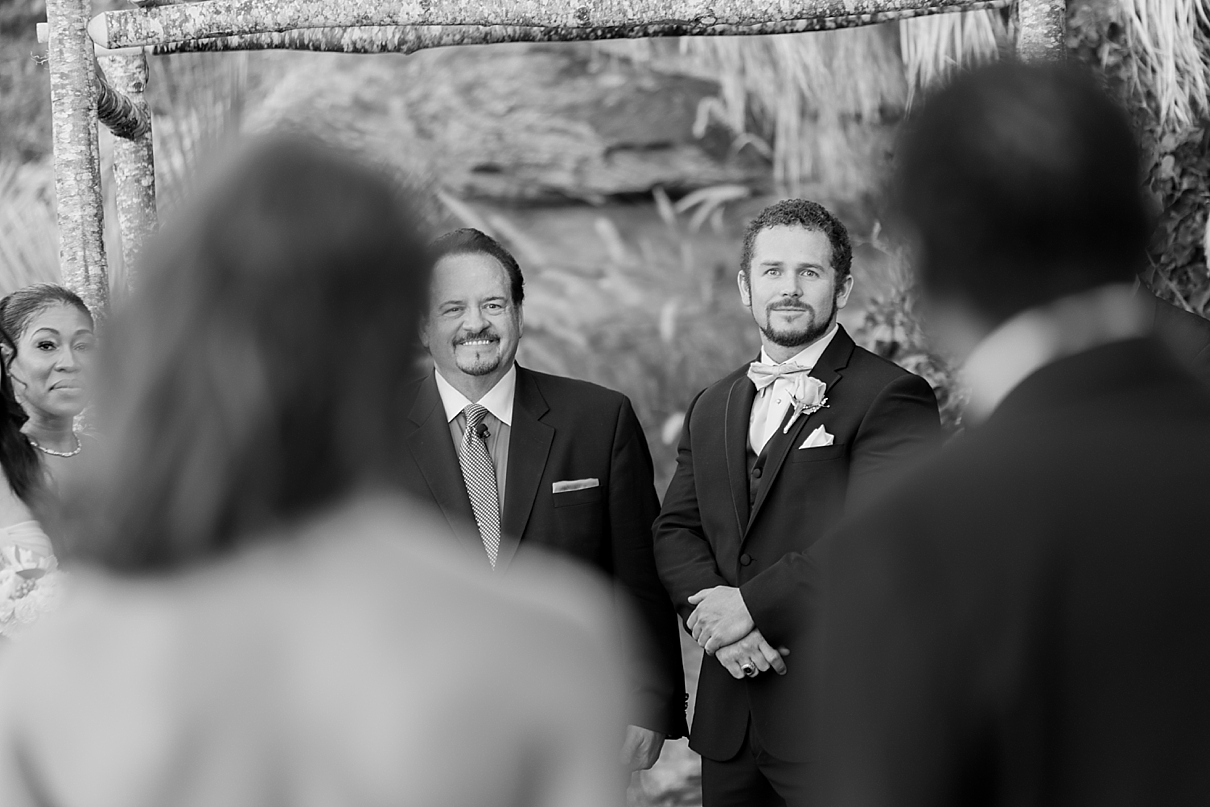 groom seeing bride for the first time walking down the aisle