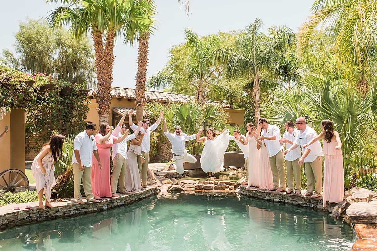 wedding party jumping in the water, wedding party by the pool