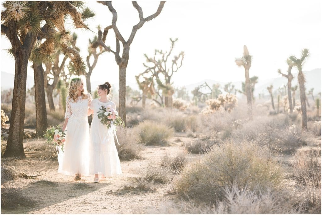 two brides in vintage wedding dress in desert