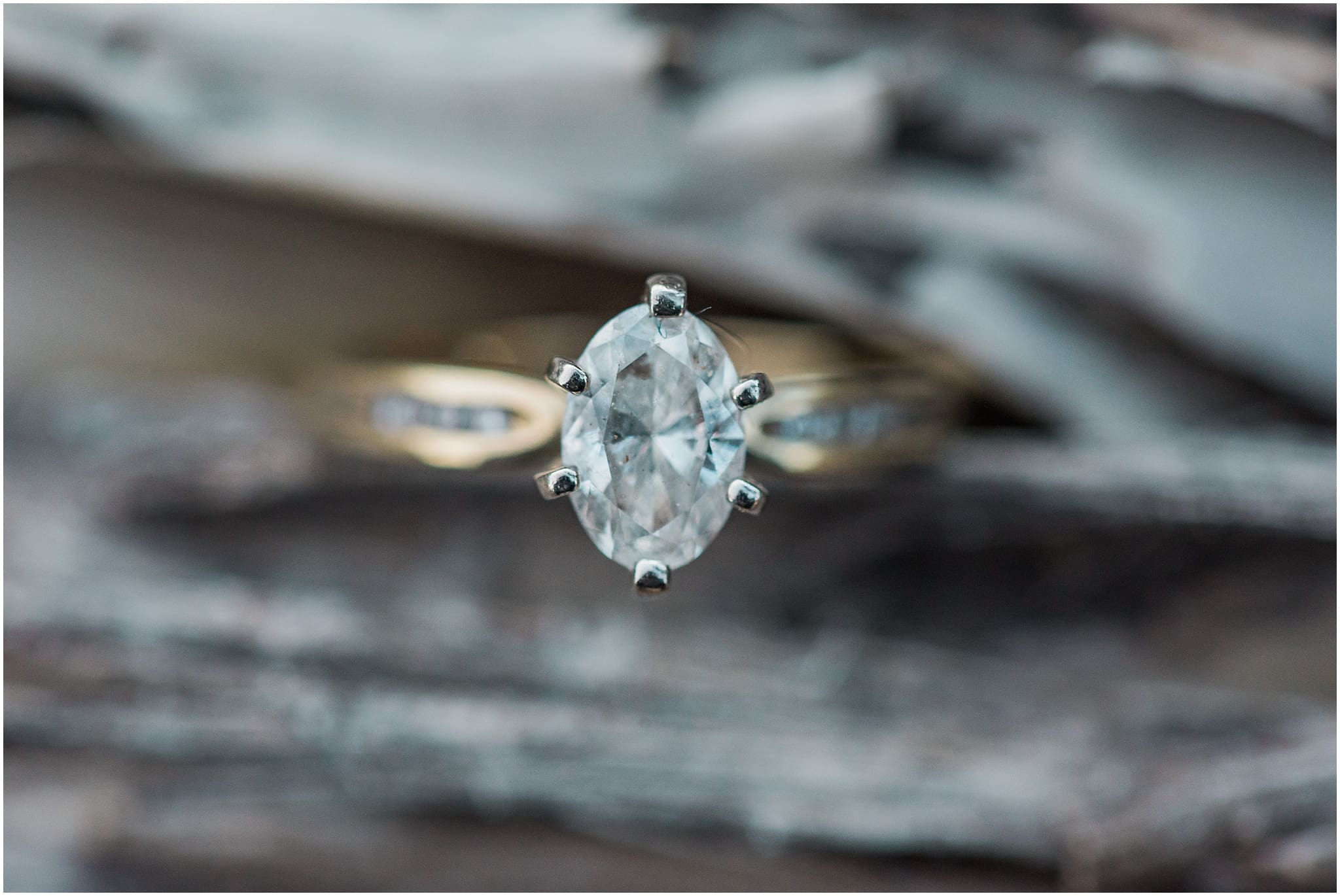 pear diamond engagement ring on wood