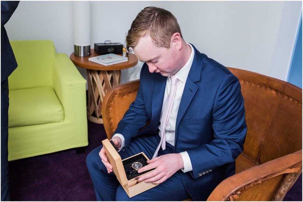 groom opening up watch gift