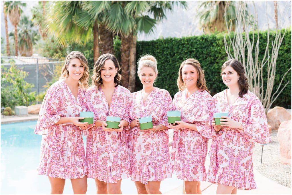 bridesmaids in robes with bridal gifts