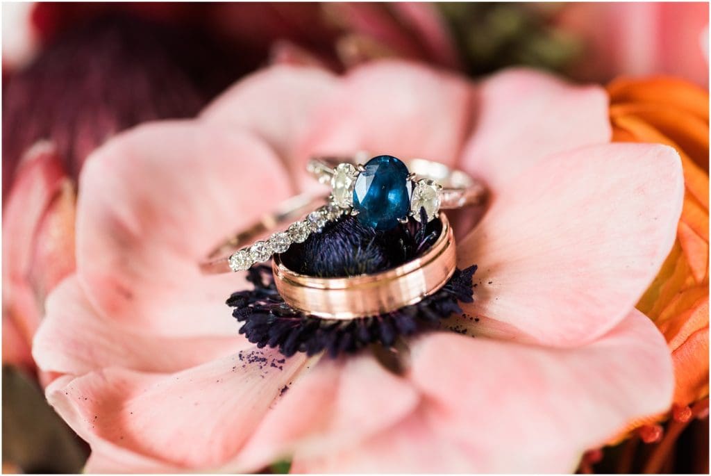 sapphire wedding ring on tropical flower