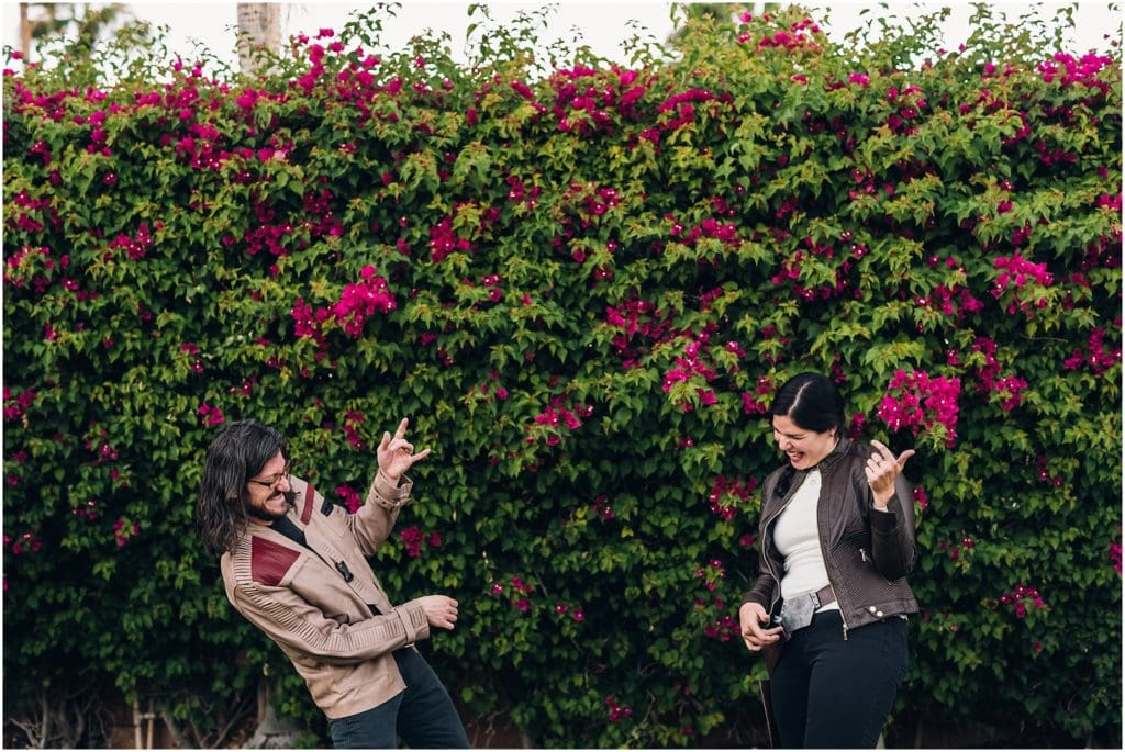 husband and wife playing air guitar