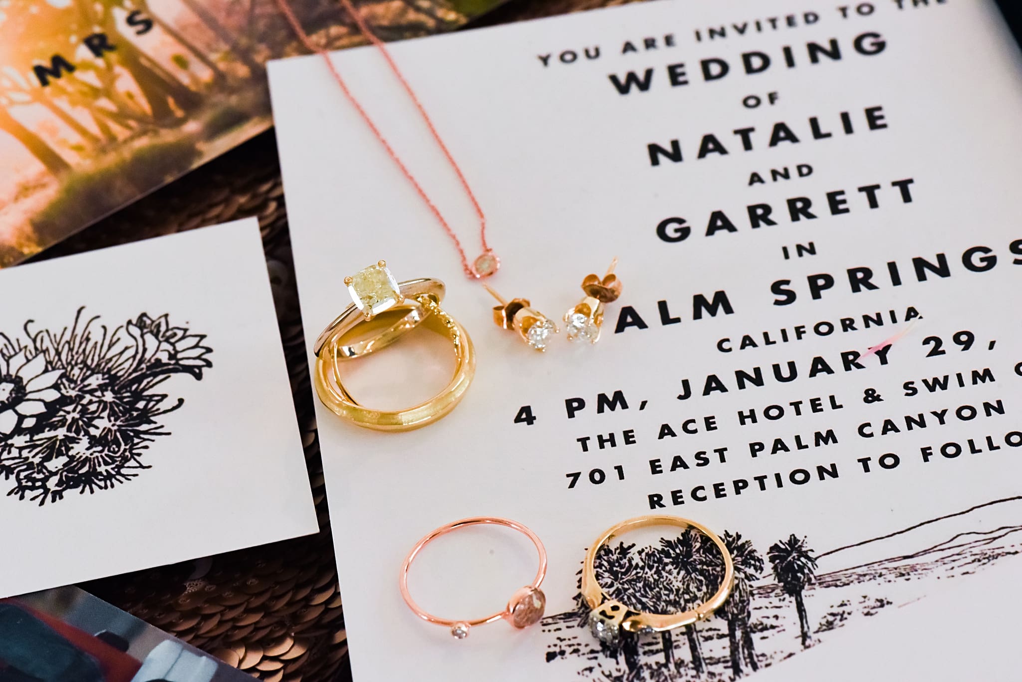 gold bridal jewelry with invitations