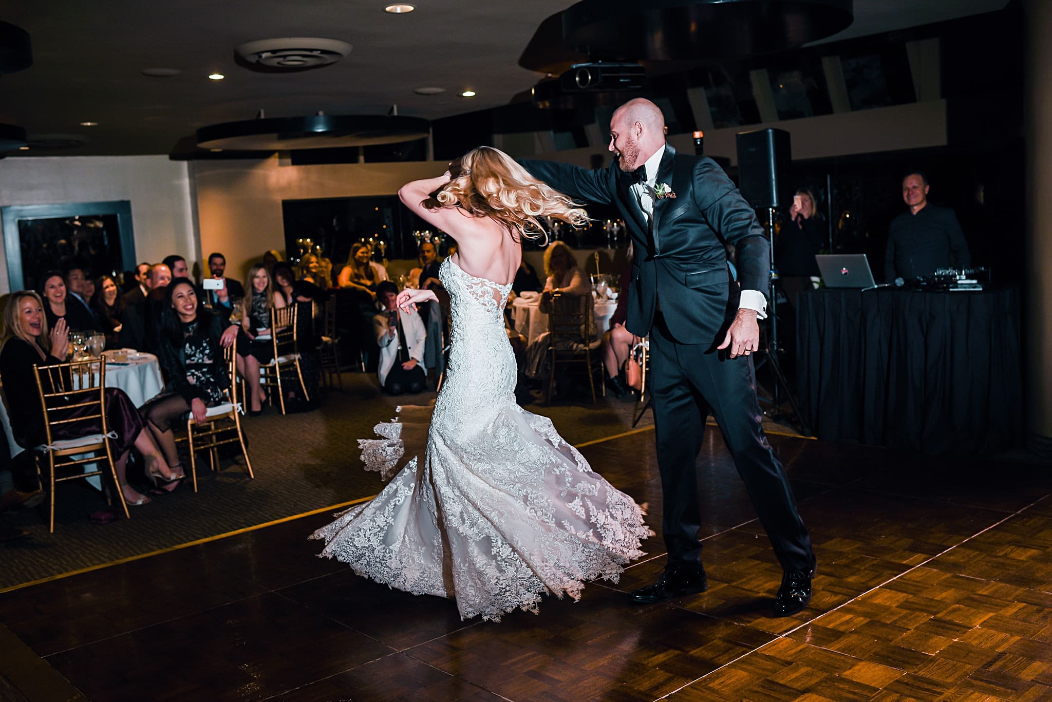 bride and groom twirling during first dance