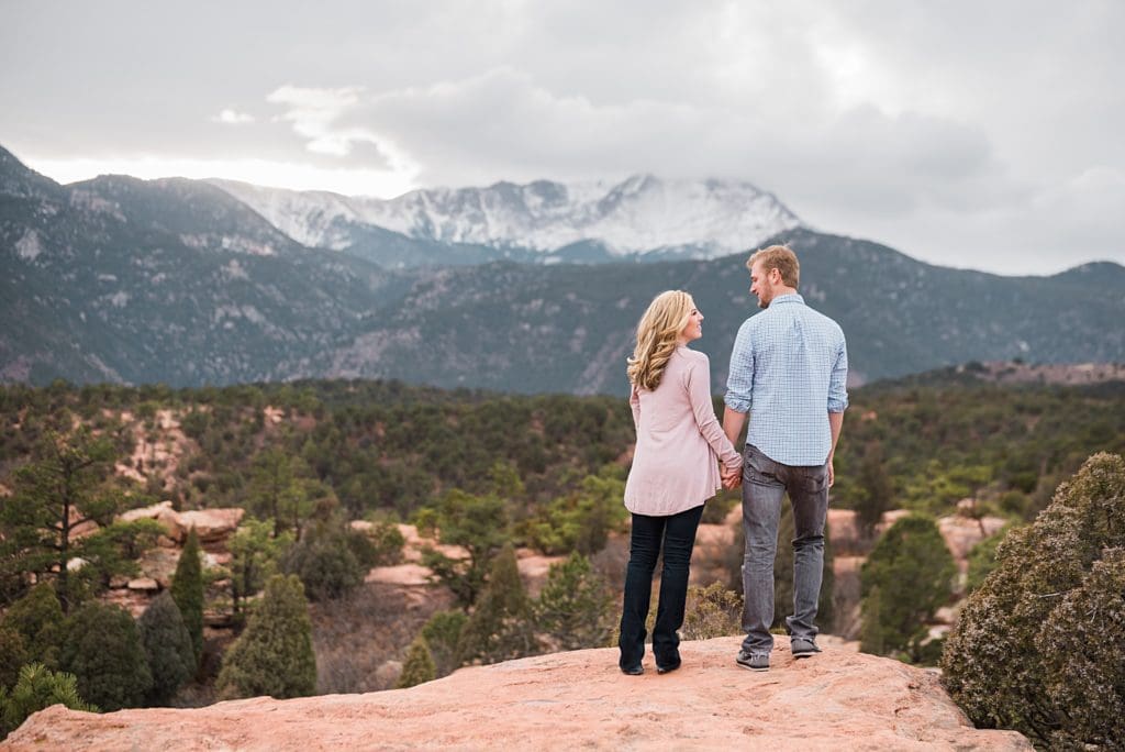 couple looking at pikes peak from garden of the gods