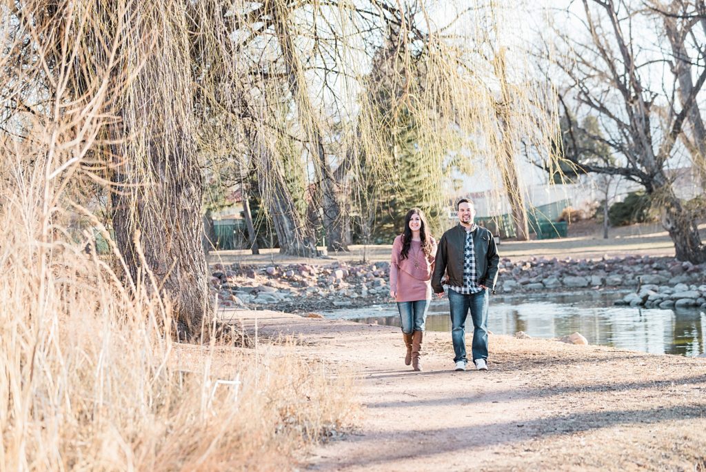 couple walking along the lake in colorado springs