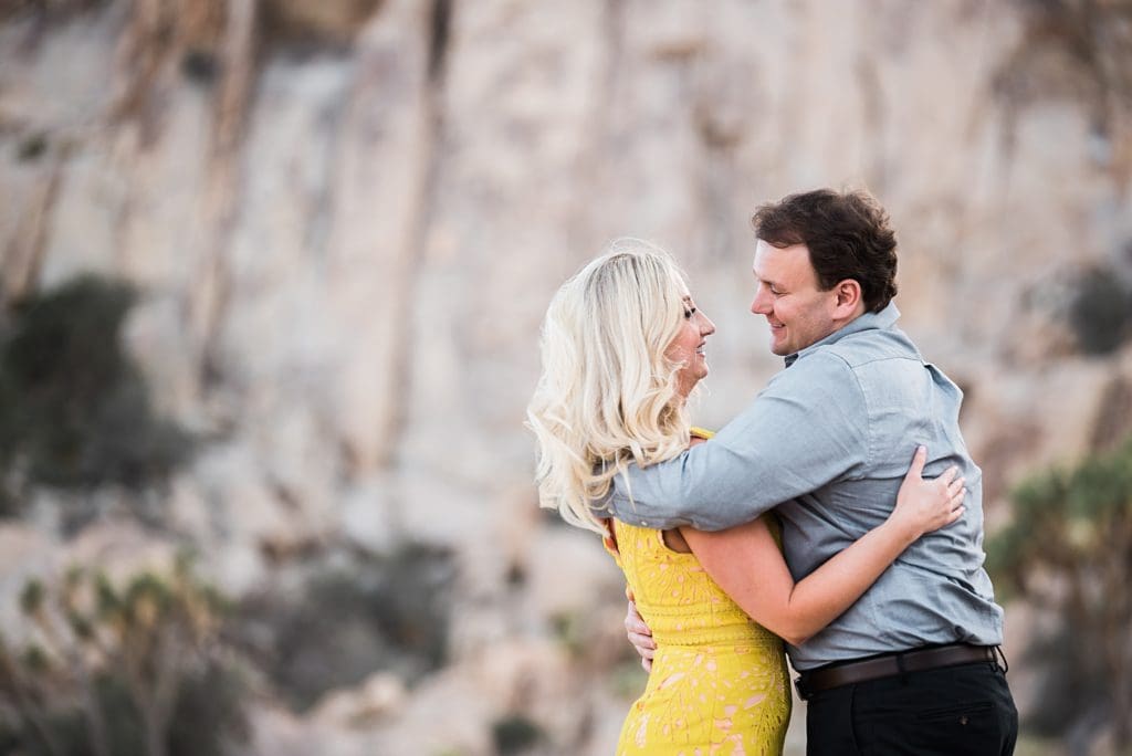 couple sharing an intimate moment in joshua tree