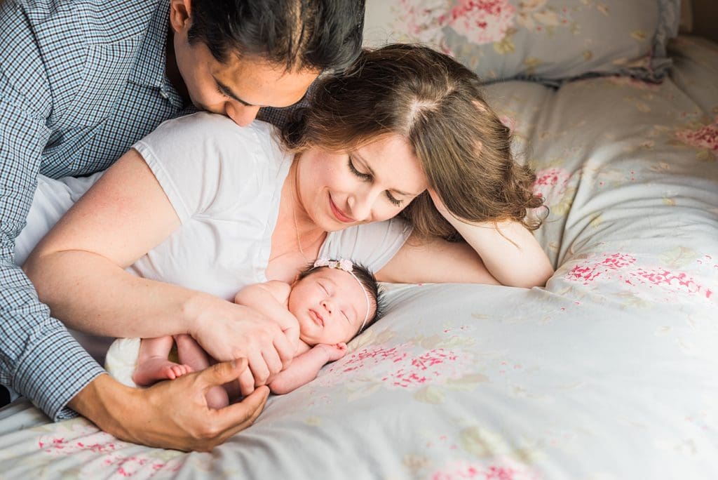new parents can't keep their eyes off their newborn