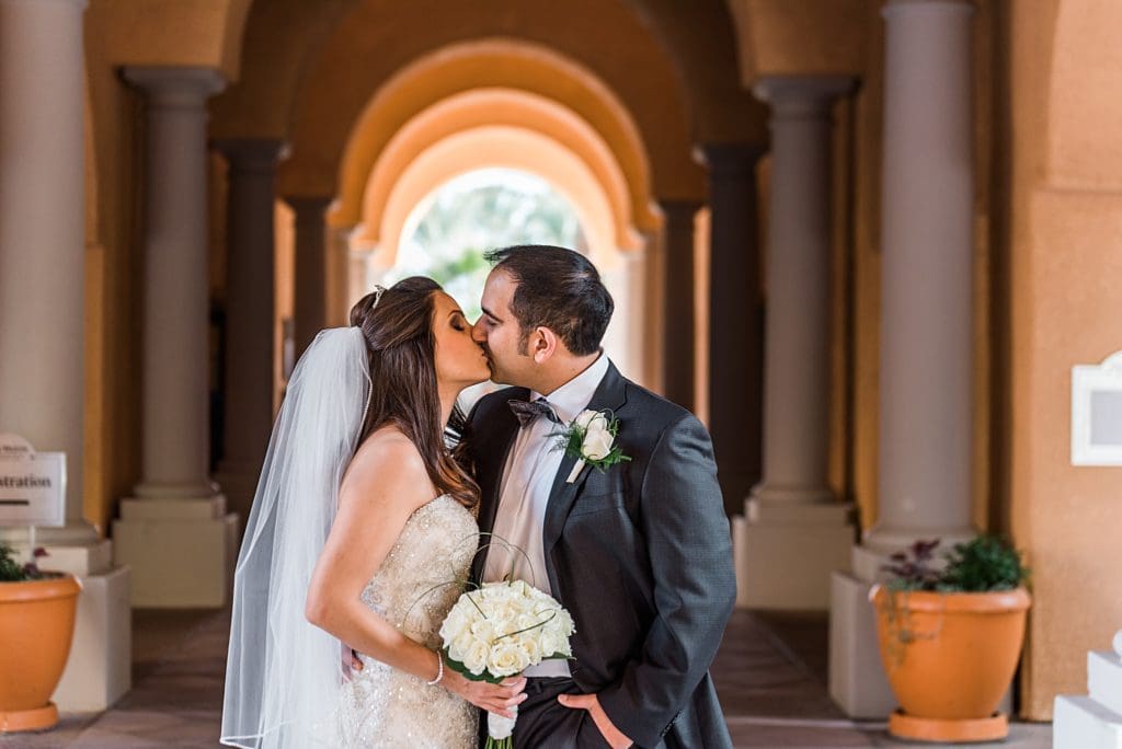 bride and groom kissing at westin mission hills
