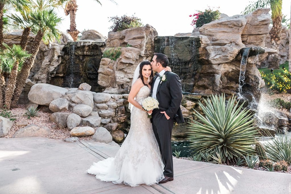 wedding couple at westin mission hills waterfall