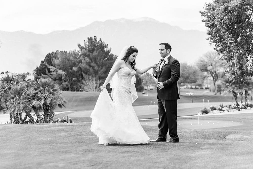 bride and groom dancing on the golf course