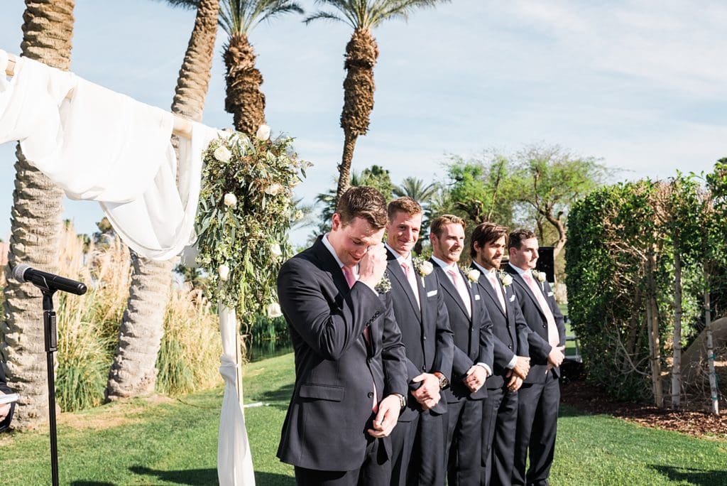 emotional groom seeing bride for the first time