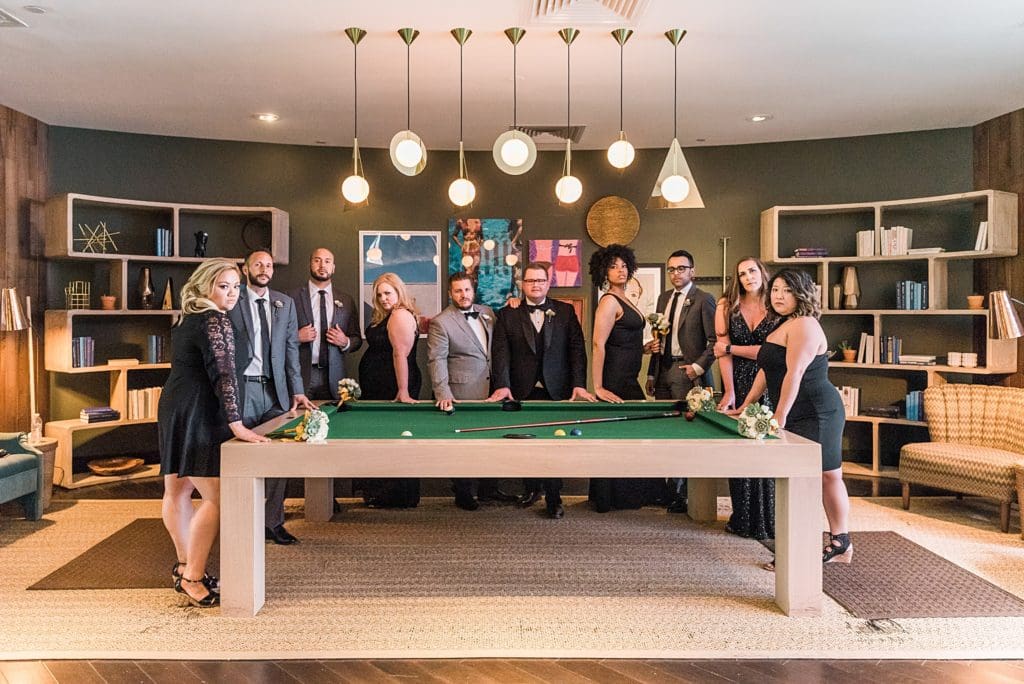 wedding party at the pool table at the riviera hotel in palm springs