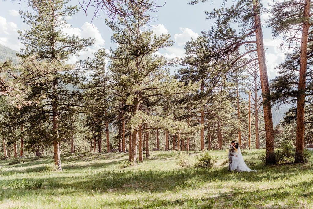 bride and groom in the rocky mountain forest