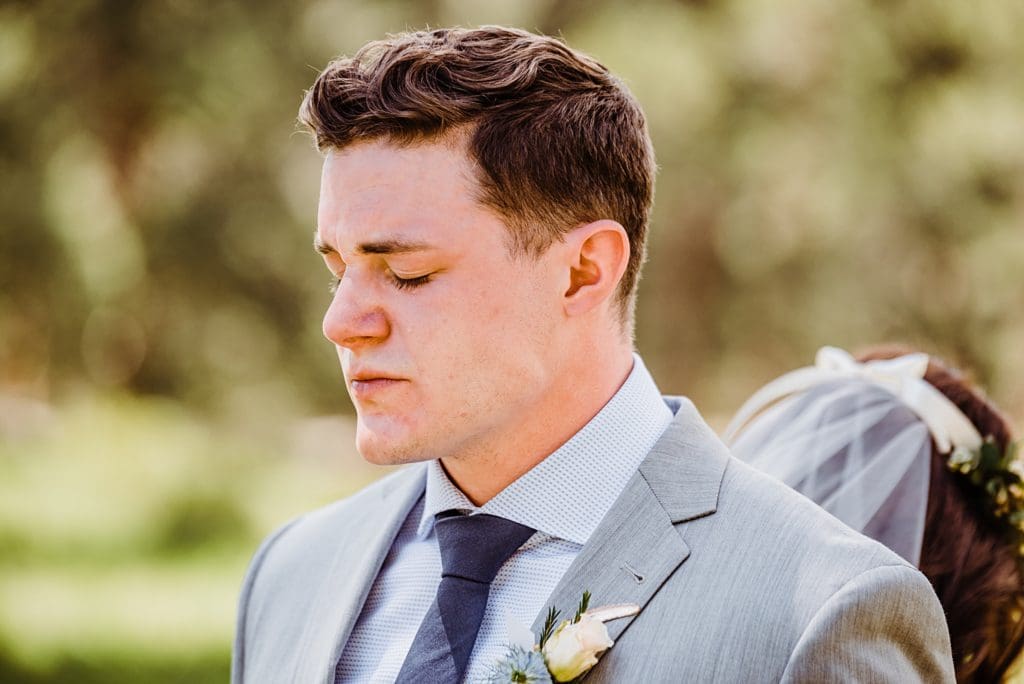 groom crying during first touch