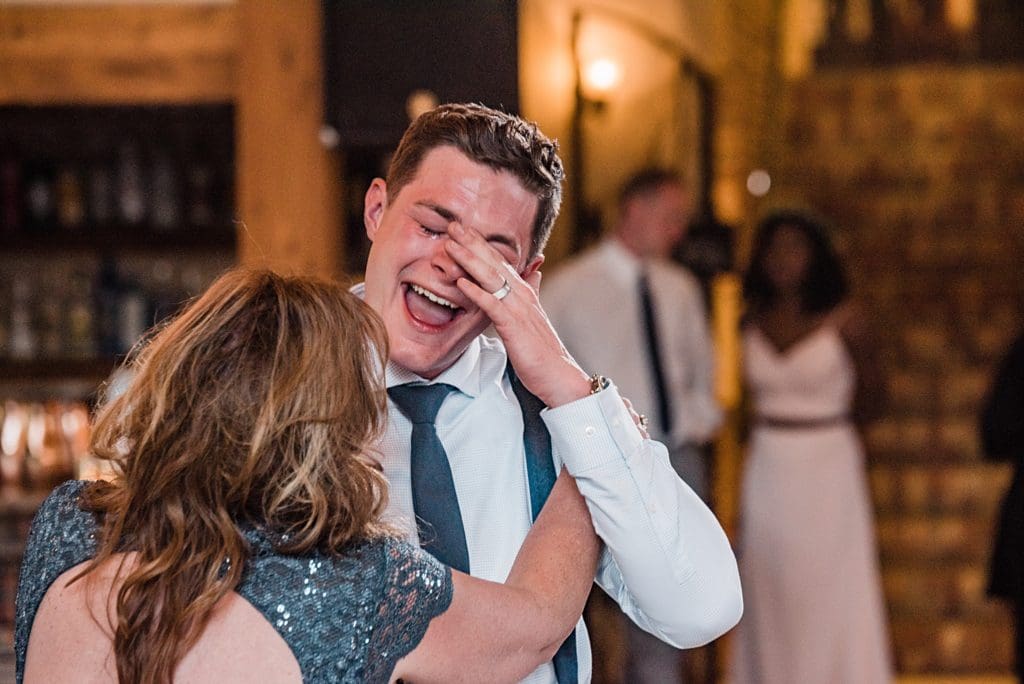 emotional groom dancing with mother