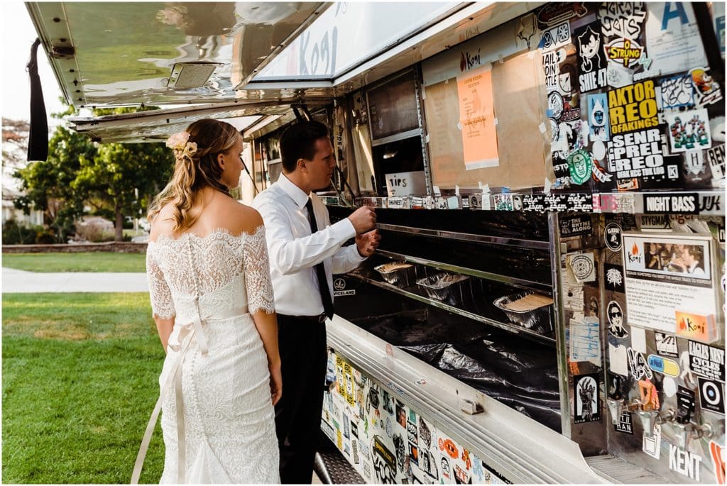 bride and groom enjoying a korean bbq taco ttruck