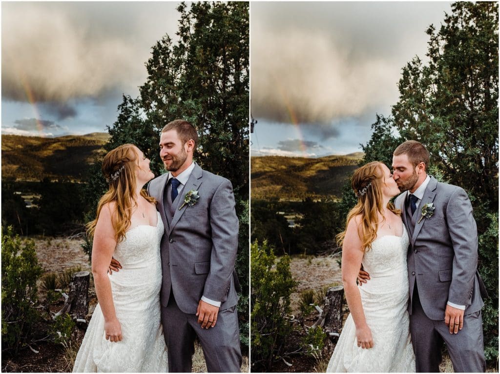 bride and groom with mountain rainbow