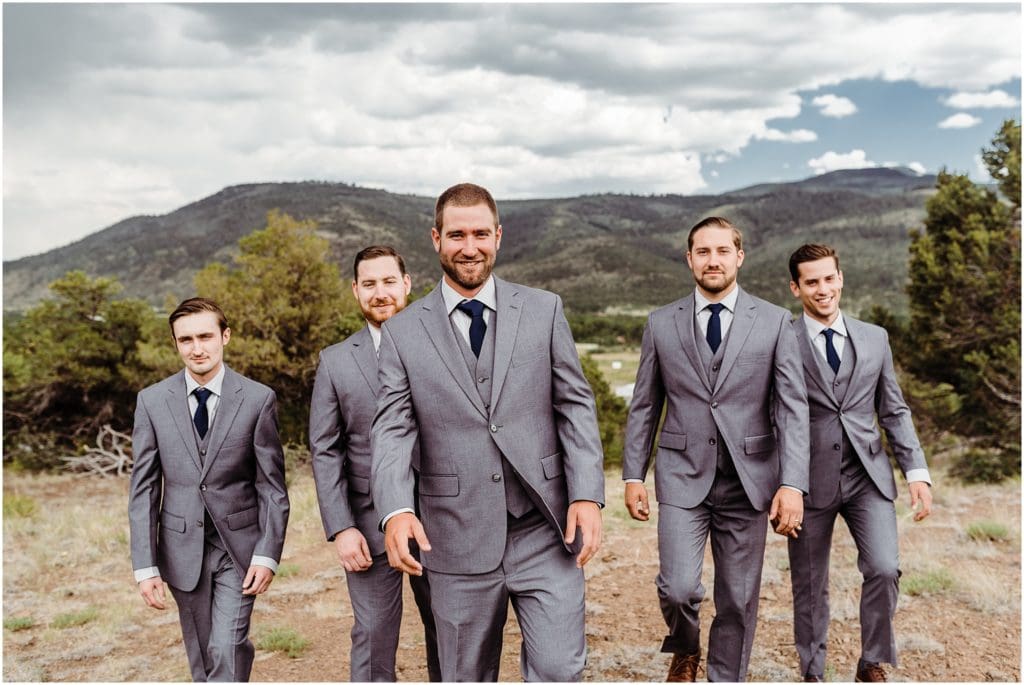 mountain groom with groom's party