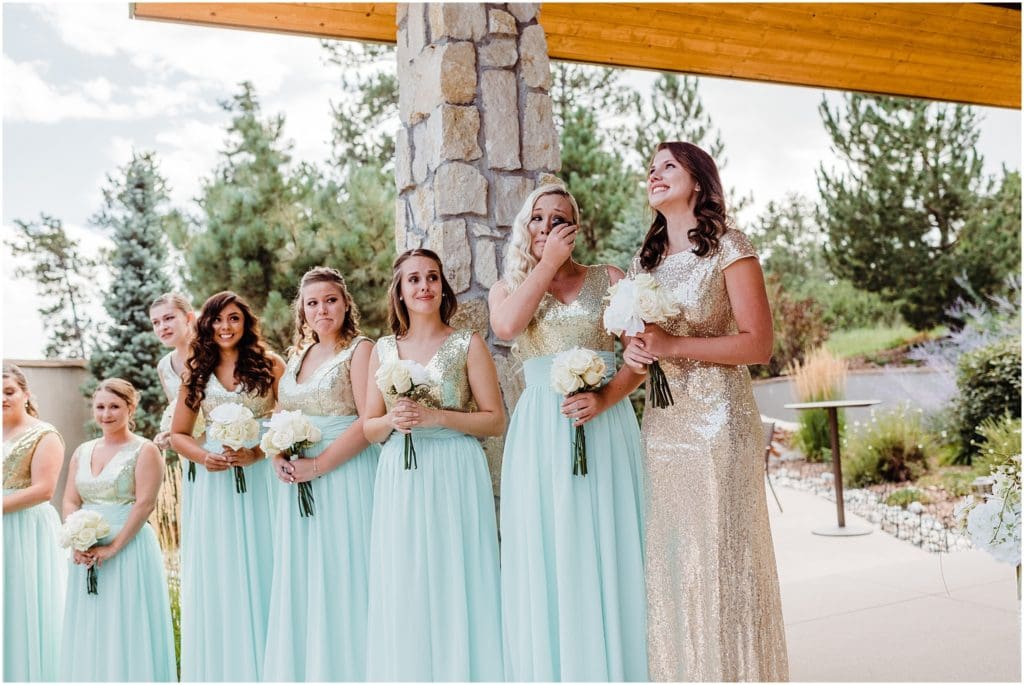 crying bridesmaids during wedding ceremony