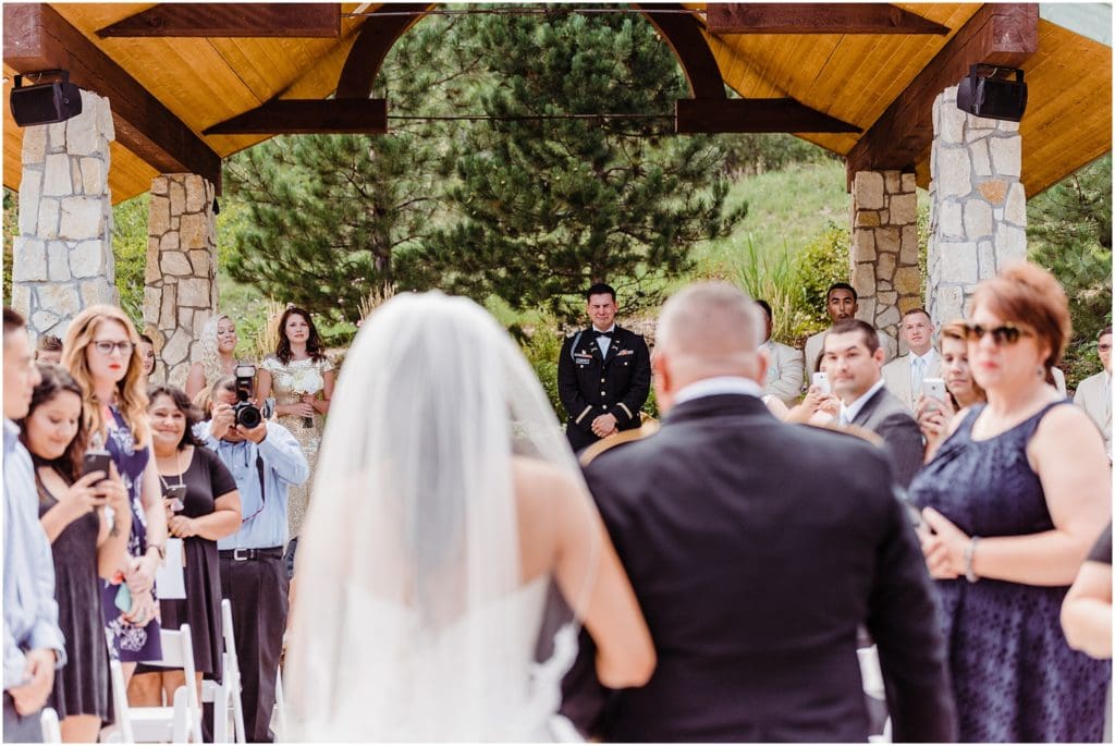 groom crying when he sees bride walking down the aisle