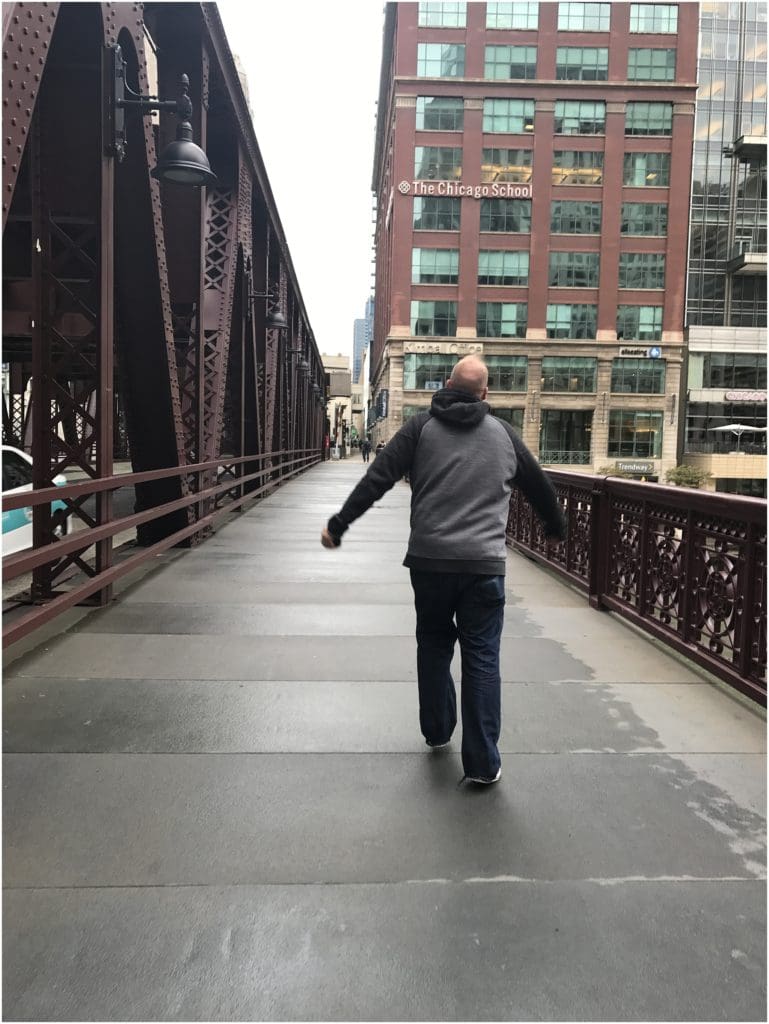 randy skipping toward pizza in chicago