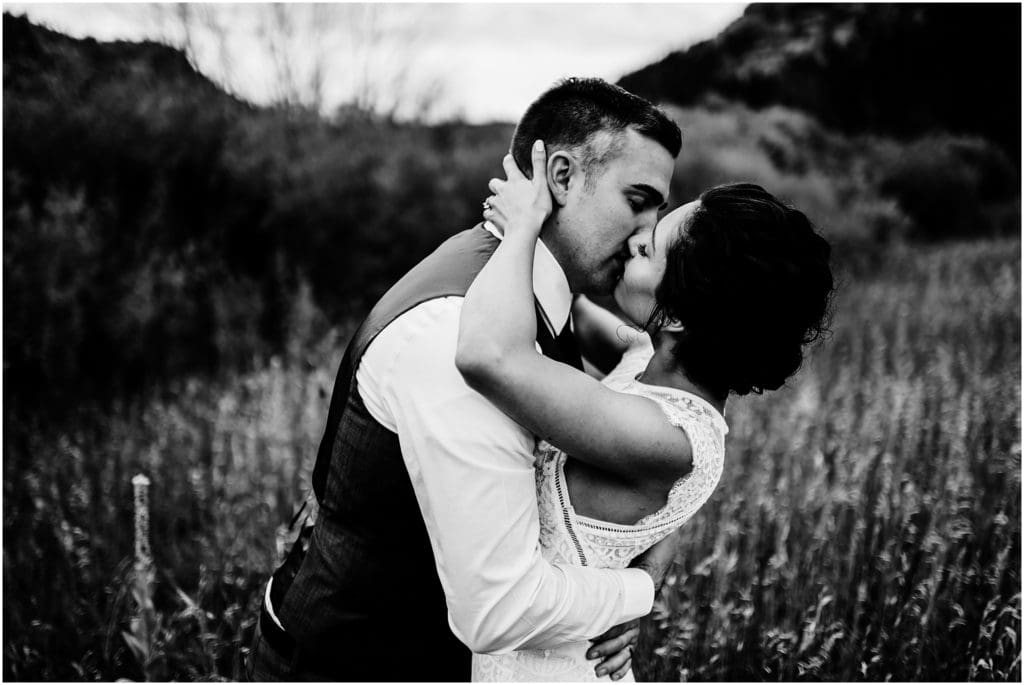 moody black and white kissing photo