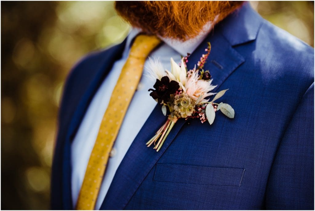 fall colored wedding boutonniere 