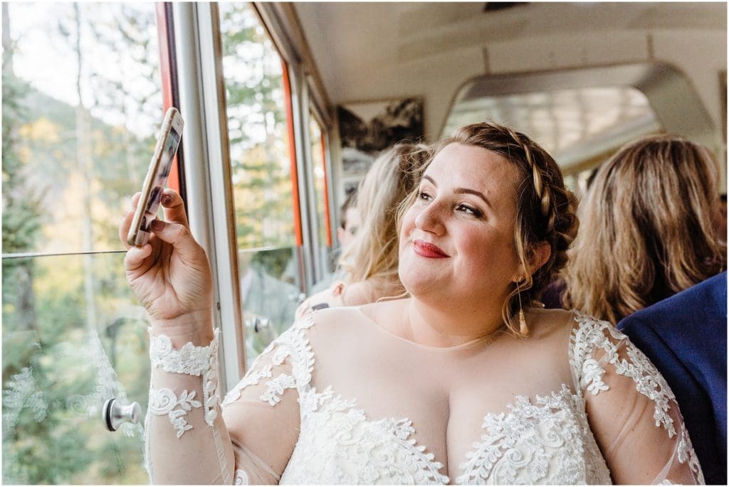 bride taking pictures with her cell phone
