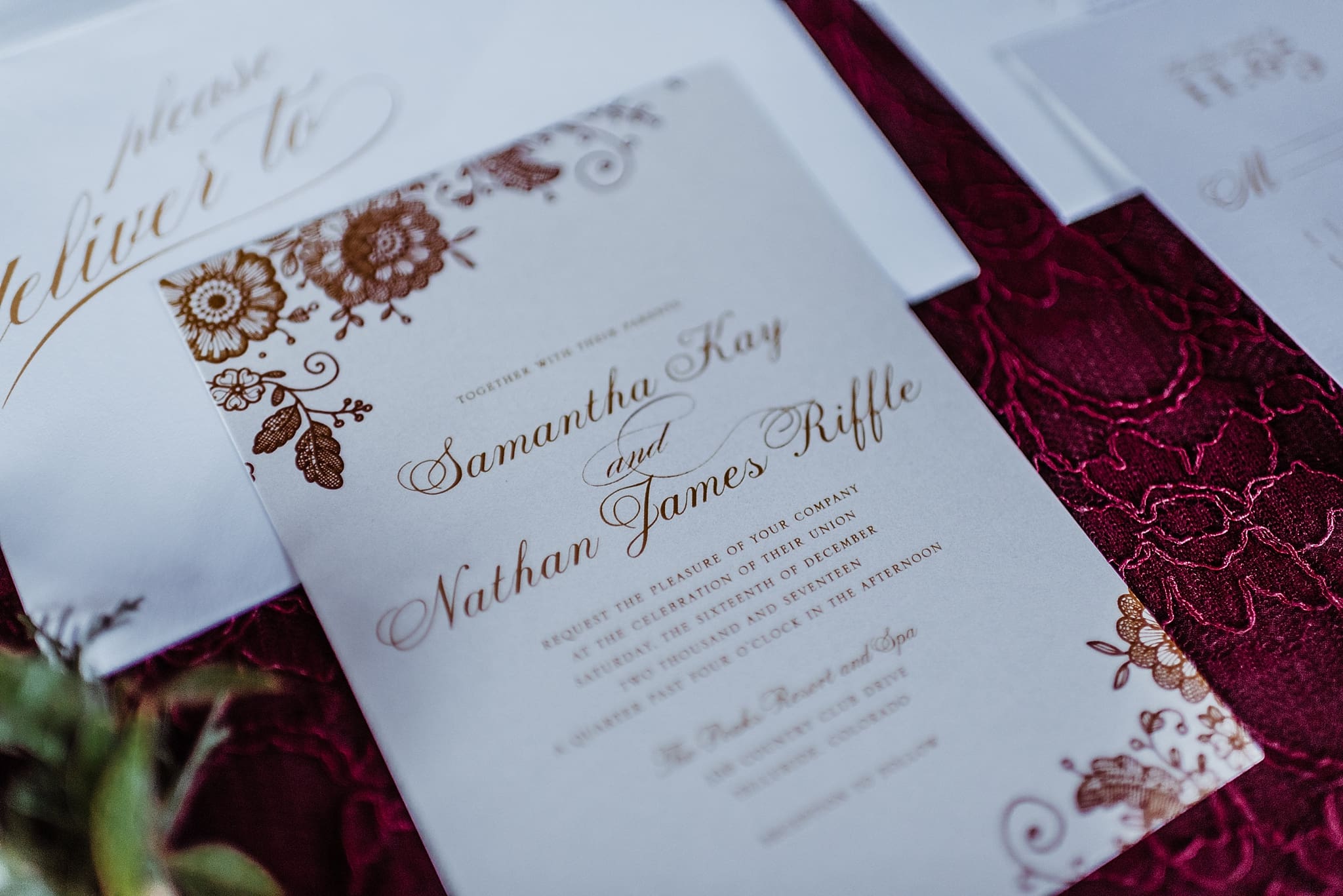 cranberry and white invitation suite