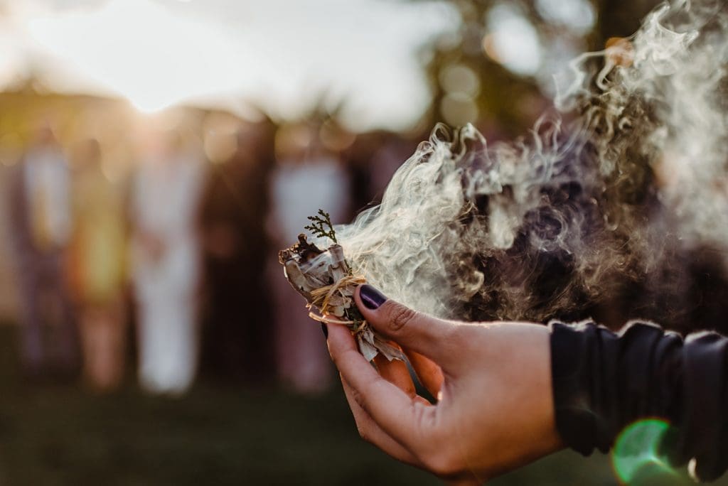 burning sage and juniper at a wedding