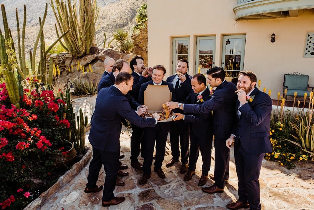 groomsmen eating pizza