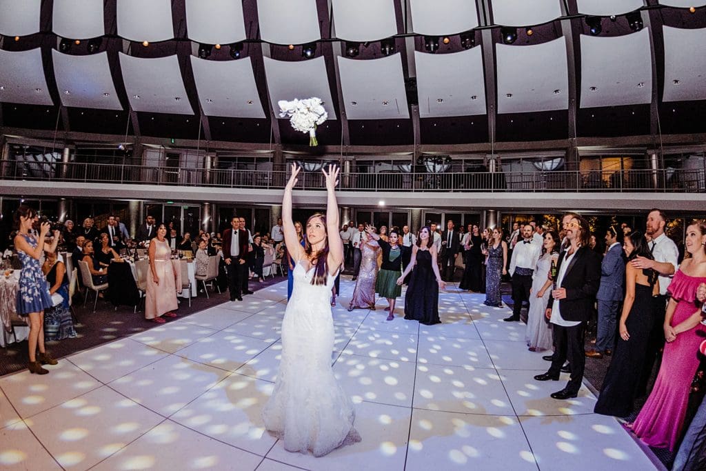 bouquet toss at wedding reception at skirball center