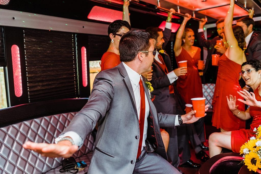 wedding party in the limo party bus
