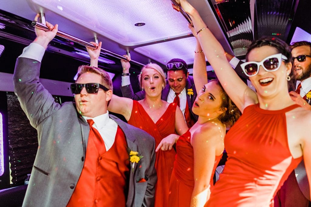 wedding party in the limo party bus