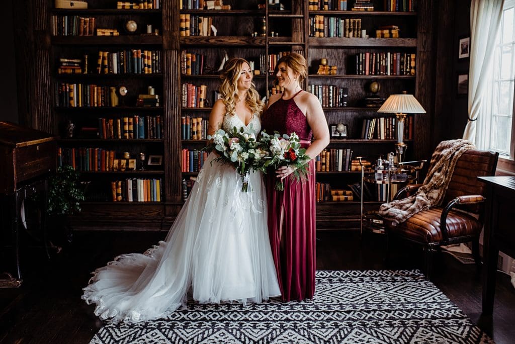 wedding photos inside the library at the manor house in littleton