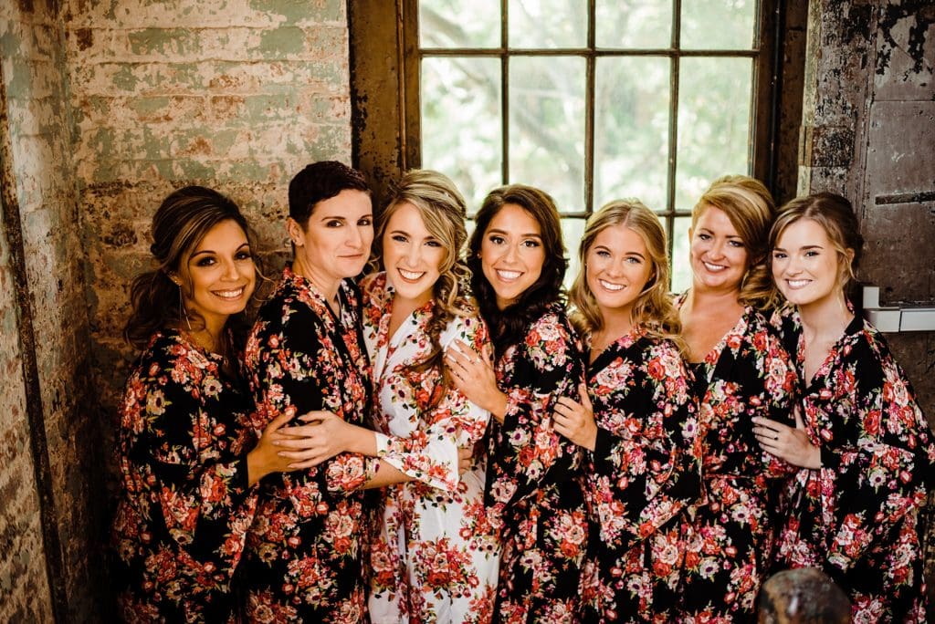 bride with bridesmaids in matching robe