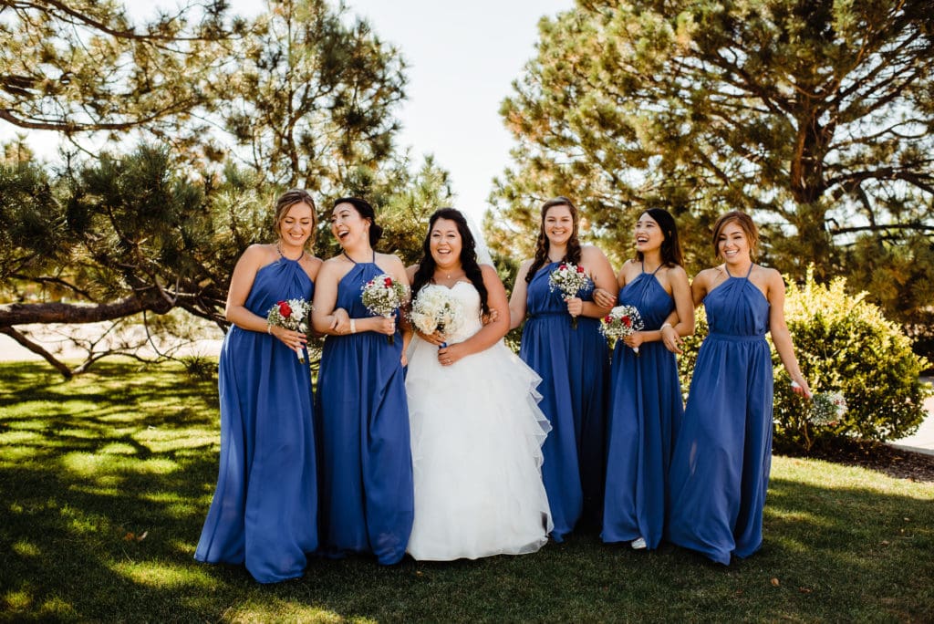 bride and bridesmaid in blue dress