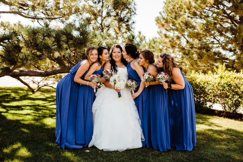 bride and bridesmaid in blue dress