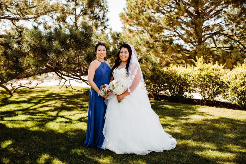 bride and bridesmaid in blue dress
