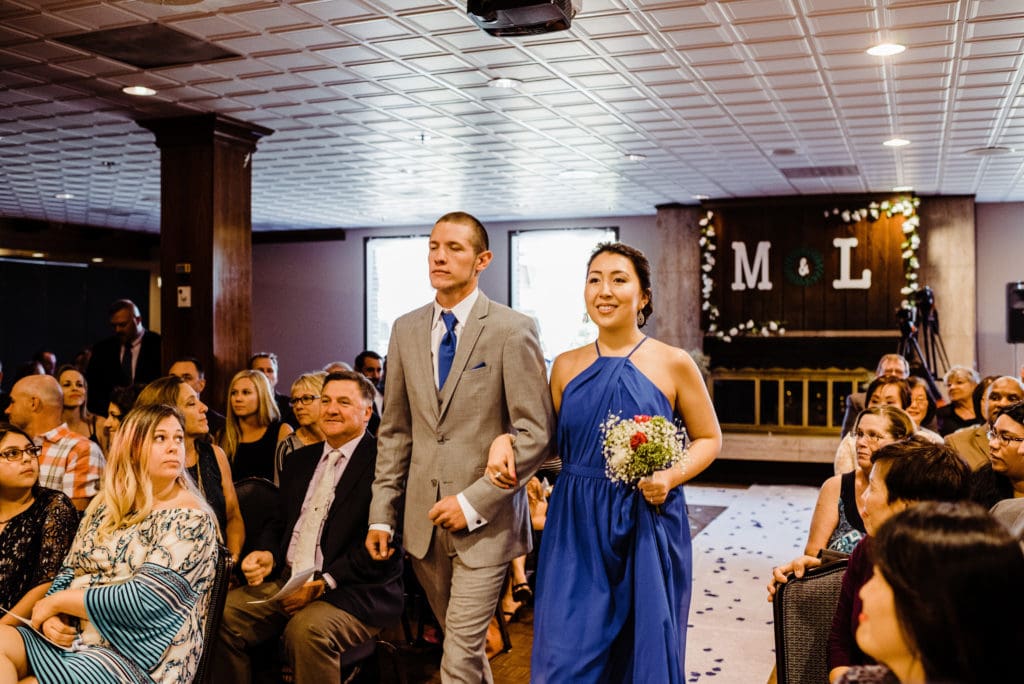 indoor wedding ceremony at the club on peterson air force base