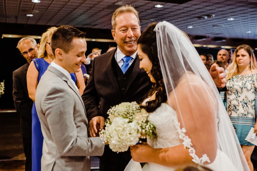 indoor wedding ceremony at the club on peterson air force base