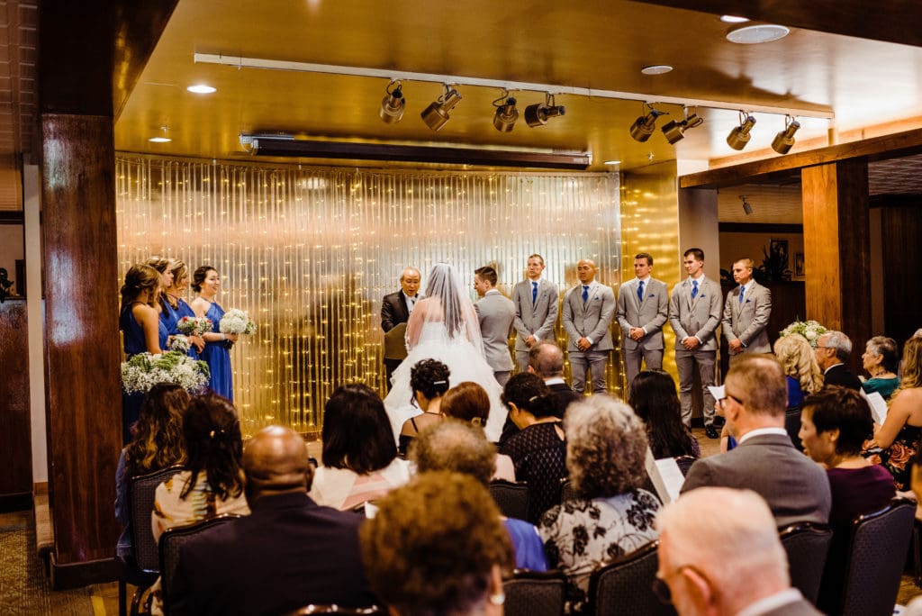 indoor wedding ceremony at the club on peterson air force base