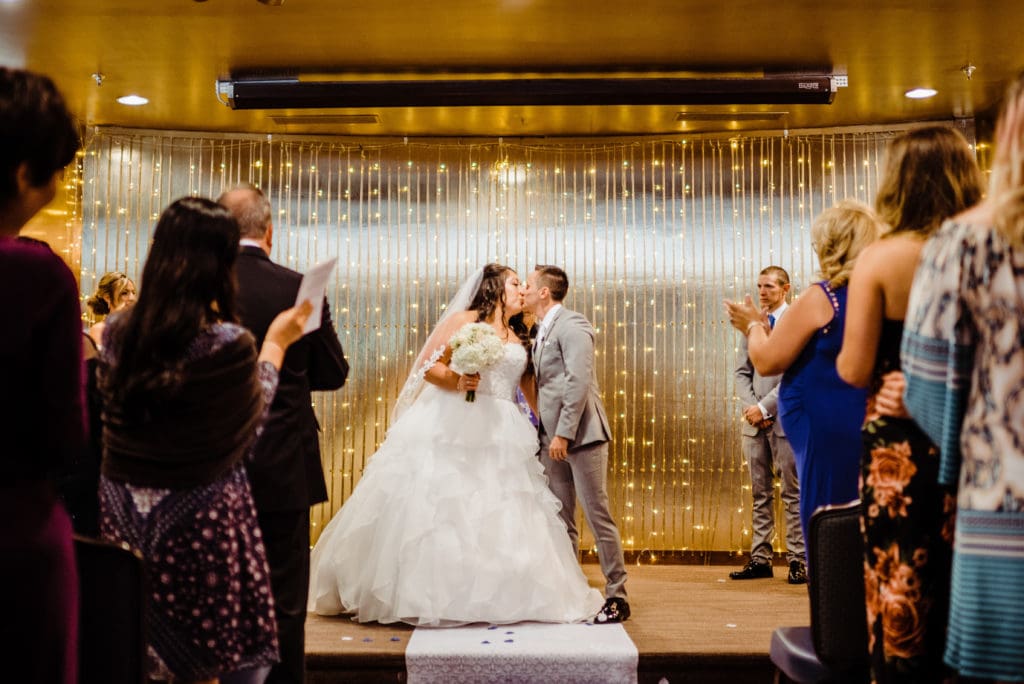 indoor wedding ceremony at the club on peterson air force base