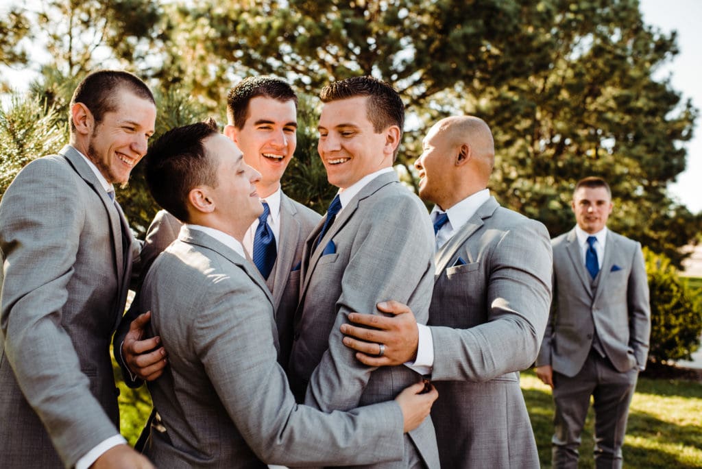 groomsmen congratulating groom 